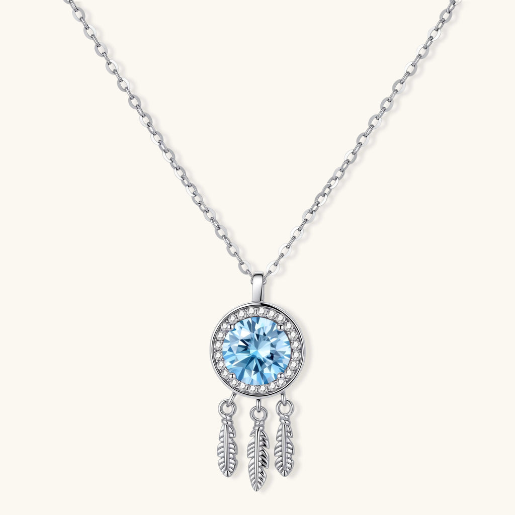 Sterling silver dreamcatcher pendant with blue moissanite center and three feather charms on adjustable chain.