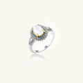 Vintage-style cocktail ring with luminous cat's eye center stone surrounded by turquoise and crystal double halo on white gold plated band